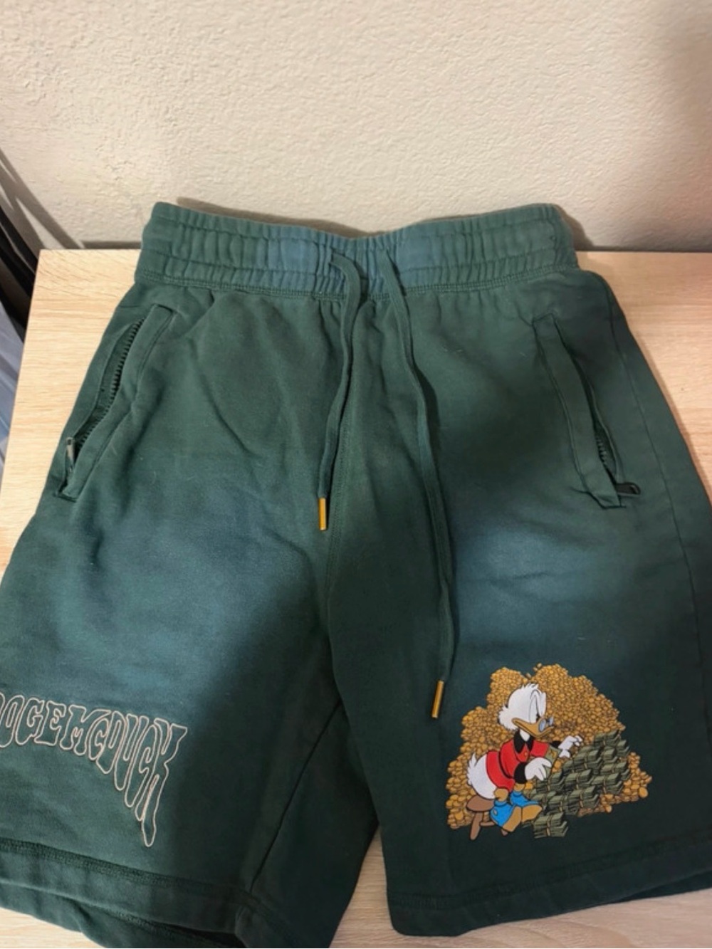 Mens Green Graphic Shorts with Scrooge McDuck Print